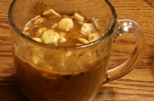 Cup of onion soup with oyster crackers