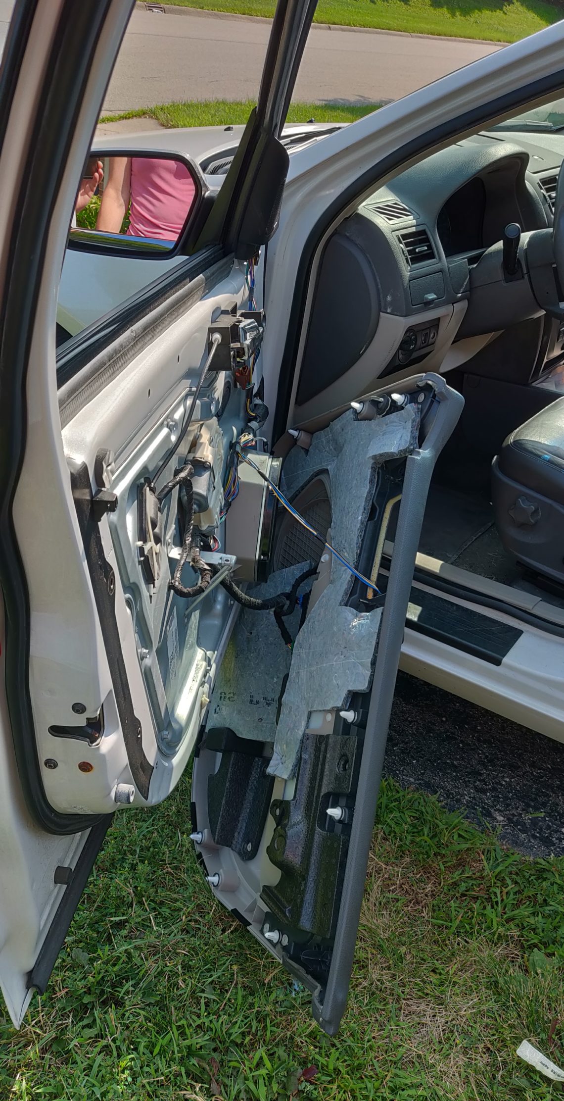 Inner trim panel of the door removed to allow access to the broken car handle assembly