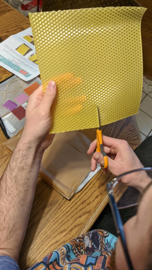 Cutting the sheet of beeswax